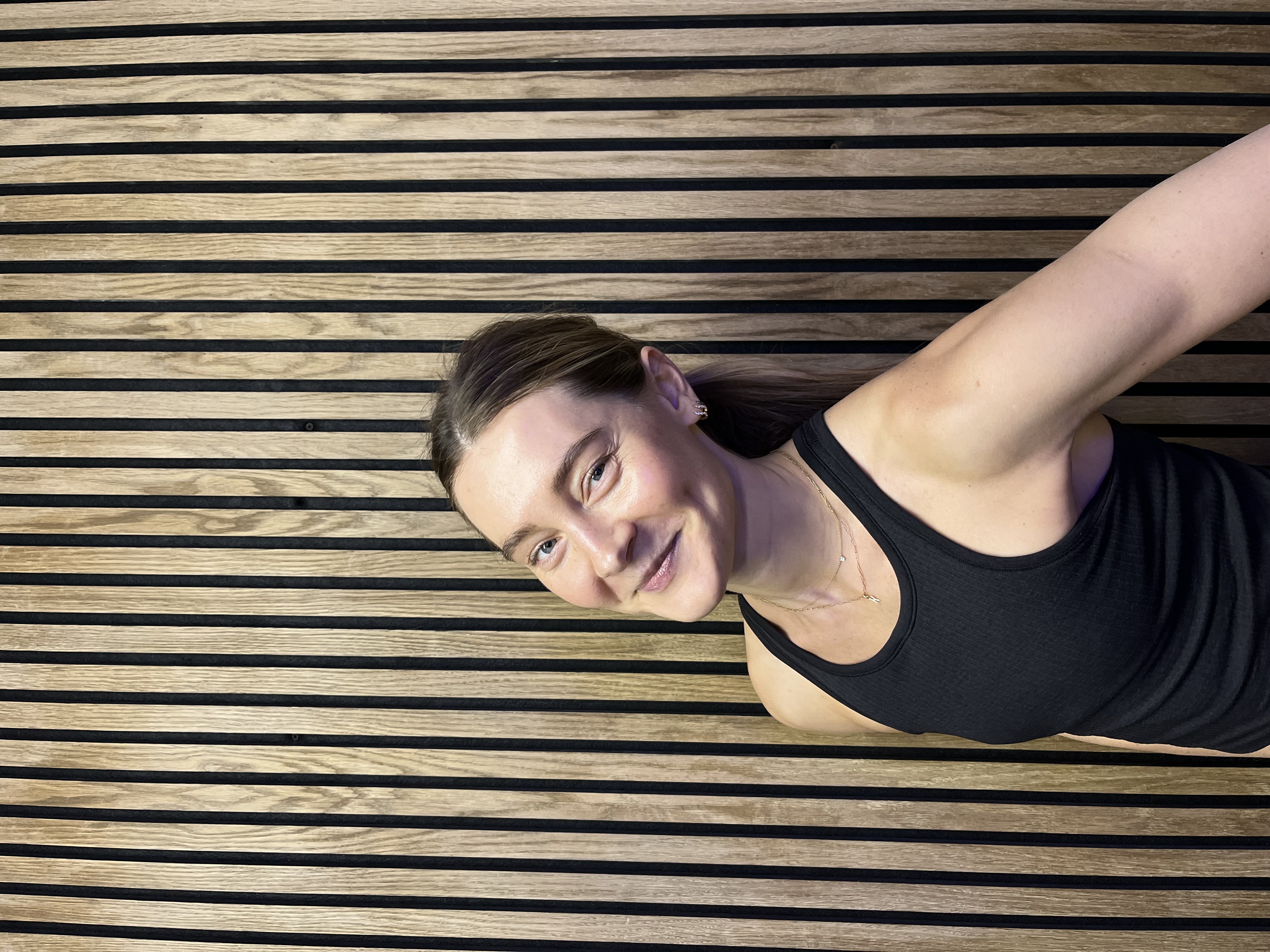 Spin Instructor Katya stood in front of a wooden board.